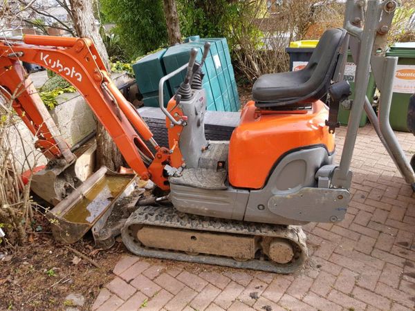 Garden clearance with mini digger.