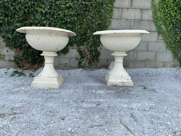 PAIR OF ENORMOUS SOLID CAST IRON URNS