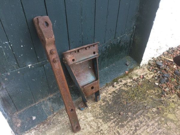 Ford 4000 tractor drawbar and lower plate.