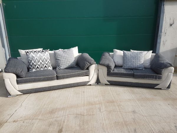 Three and two seater grey and cream sofas