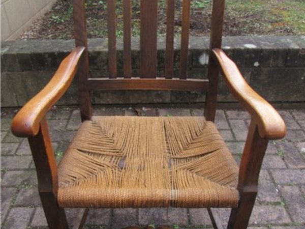 Original c1910 oak armchair with rope seat.