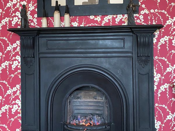 Cast iron fireplace with marble hearth