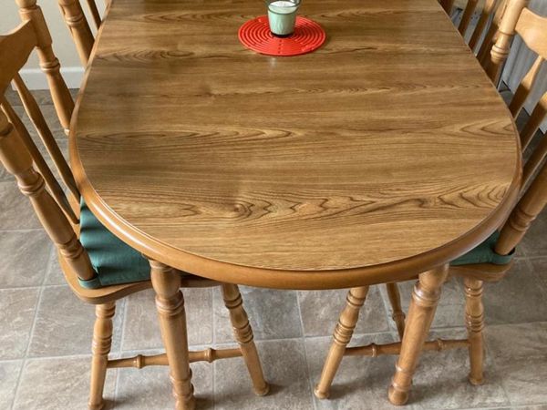 Extending Oak table and four chairs