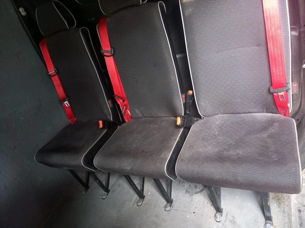 3 bus seats and passenger sliding door