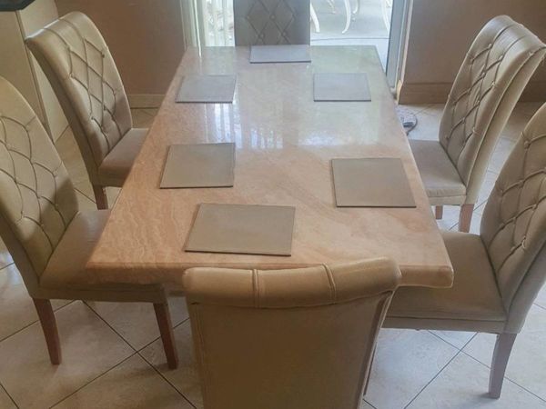 6 cream leather chairs and marble table