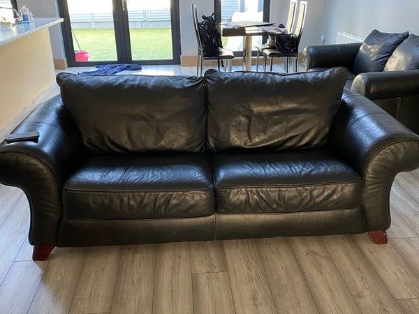 Sofas two 3 seaters and a 2 seater black in good condition