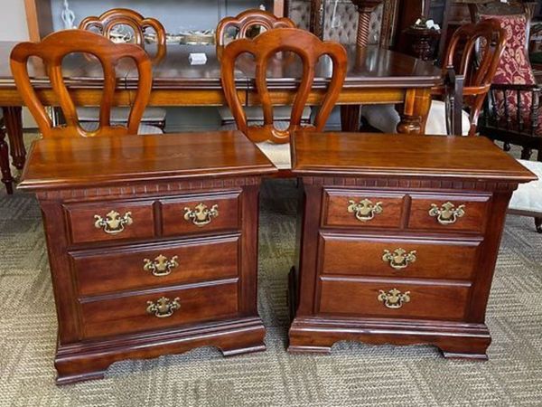 A pair of mahogany chest of drawers with brass handles