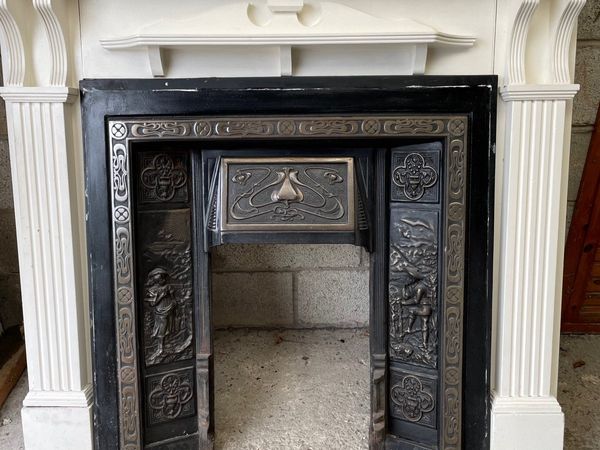 Fireplace mantel and cast iron inset