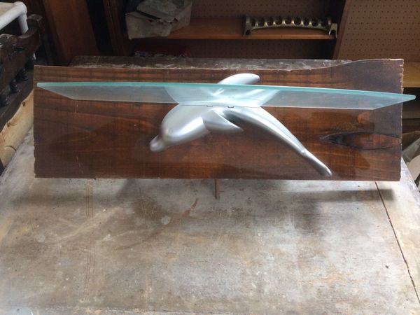 Dolphin shaped glass shelf