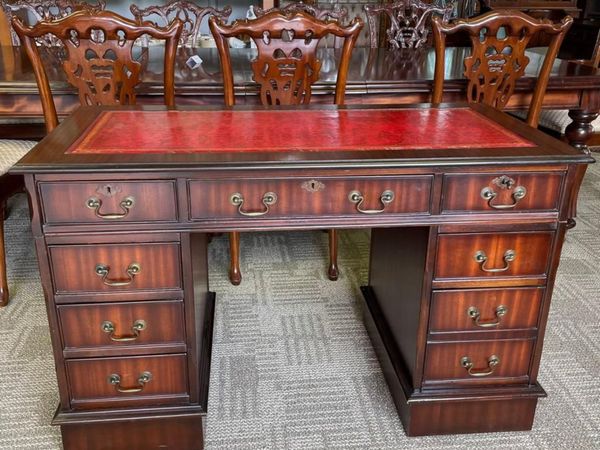 Stunning twin pedestal mahogany writing desk with red leather top