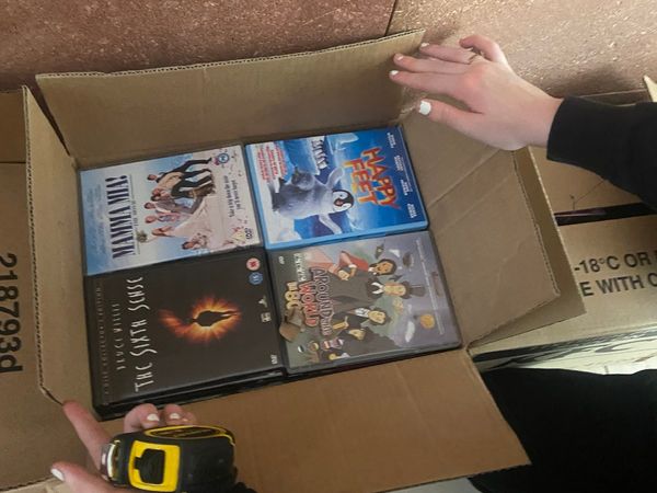 Box of dvds, cds and ds games