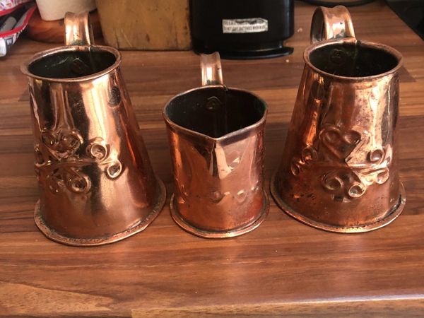 3 brass jugs
