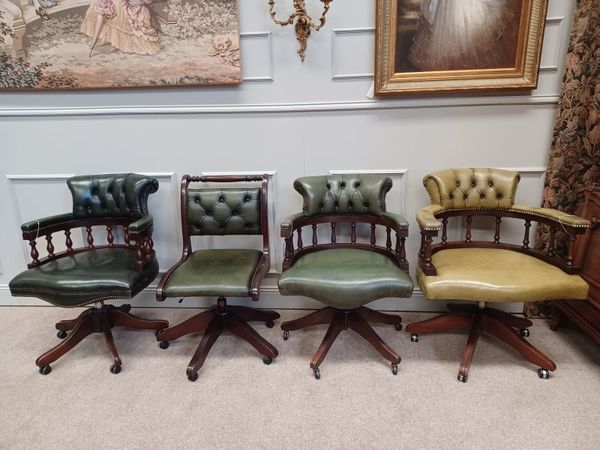 Four Chesterfield Captains Chairs