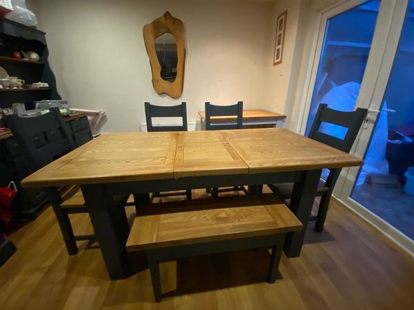 Solid Oak Extendable Dining Table 4 chairs and a bench.