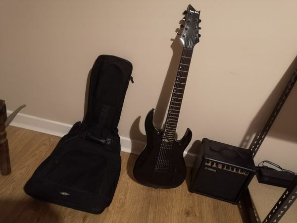 7 string electric guitar and Yamaha g15 amplifier