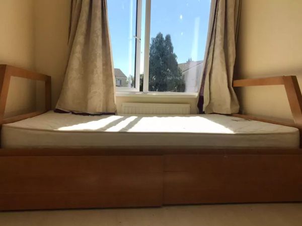 double bed with two drawers and matteress