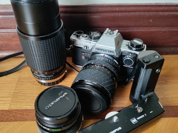 Olympus OM10 SLR with lenses and accessories