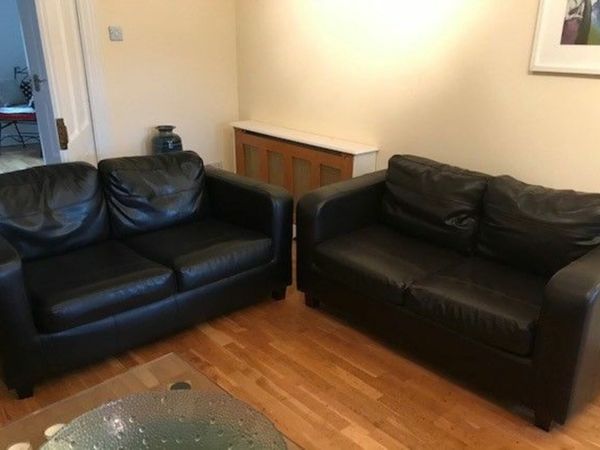 Two brown sofas