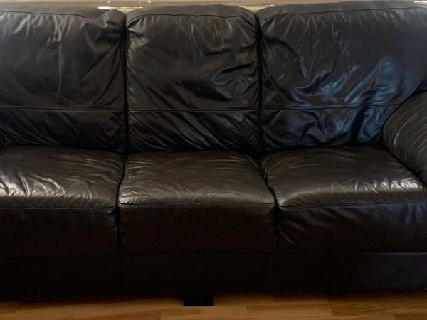 Black leather couches 2 and 3 seater