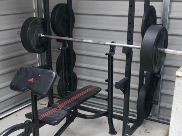 Squat rack with pull up bar and spotting arms