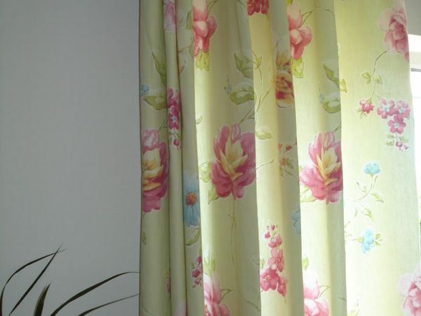 PAIR OF LINED  FLORAL COTTON CURTAINS. 130 X 90 .