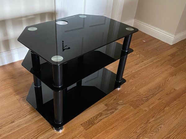 Black glass TV stand for sale in Kildare for €30 on DoneDeal