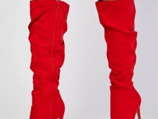 Red runched suede knee high boots