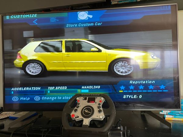 PS2 plus steering wheel plus games