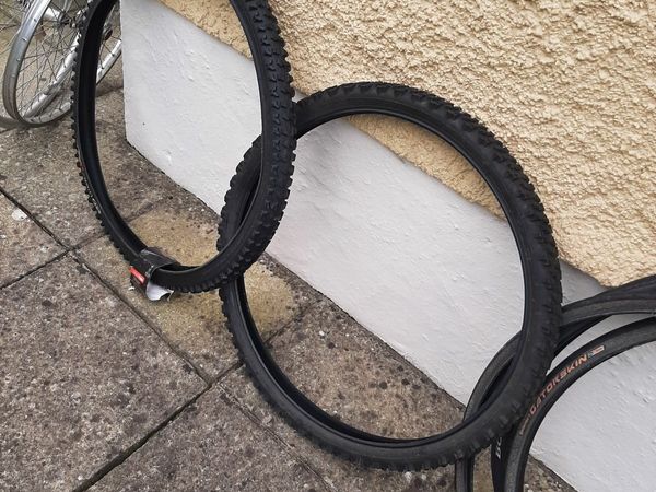 mountain bike tyres and some mountain bike wheels with tyres fitted