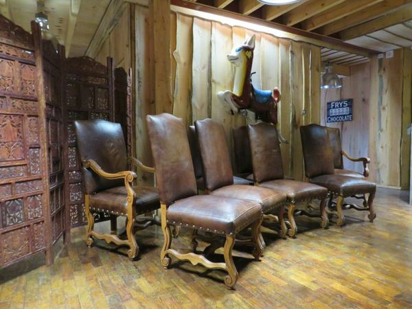 8 Paul Robert Autry Chairs (Buffalo Leather)