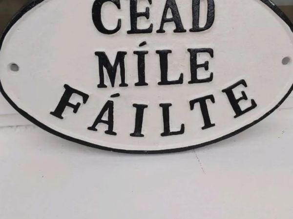 Cead mile falta cast iron  sign