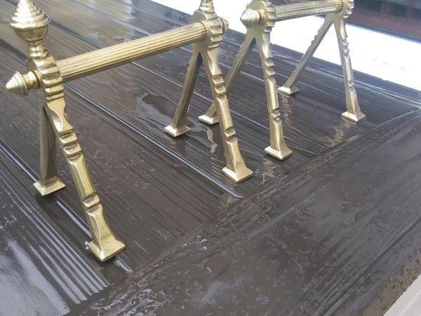 Old brass fire stands