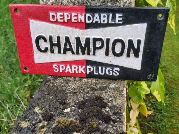 Champion plugs cast iron sign