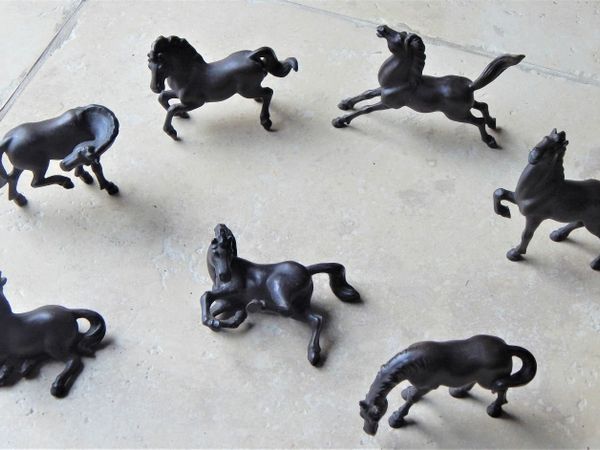 Collection of 7 stamped miniatures horses made in plaster