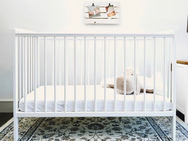 Baby Elegance Cot along with mattress and two fitted jersey sheets