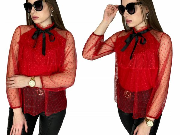 Lace blouse with a bow at the neck