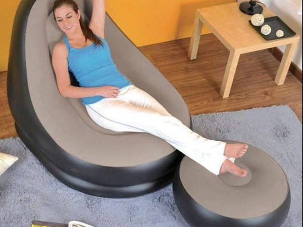 Inflatable chair with footstool