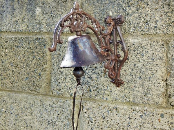 Cast iron bell and wall bracket