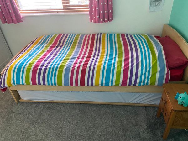 Single bed with spare bed underneath