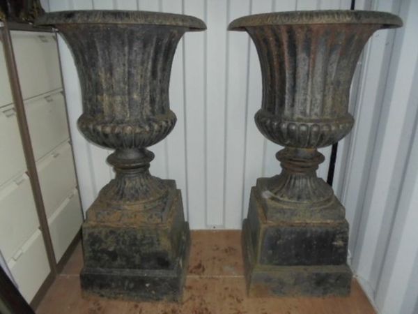 a large pair of victorian cast iron urns