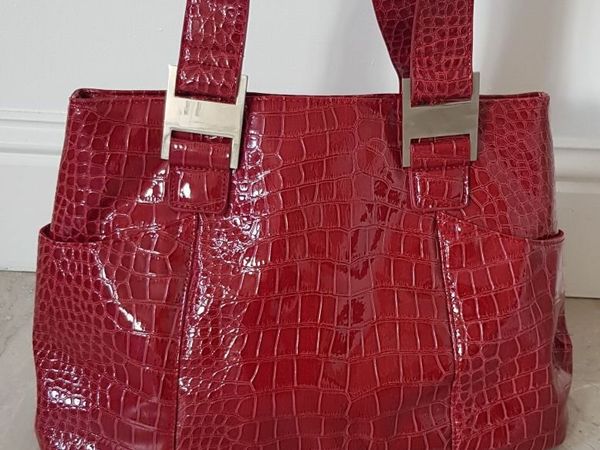 Red patent alligator print handbag