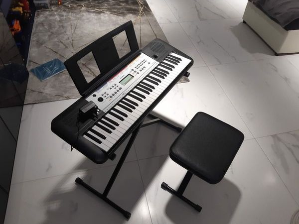 Yamaha piano with stool