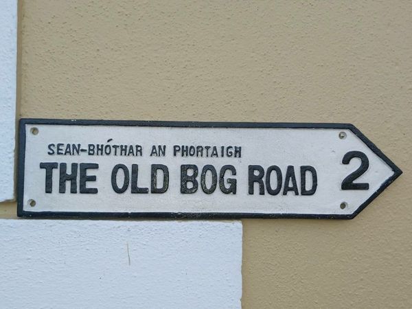 The old  bog road cast  iron sign