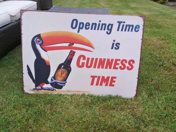 Large Guinness  opening times  sign