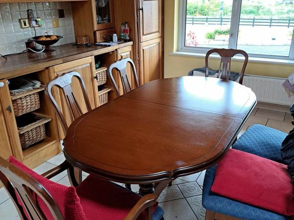 Beautiful  cherry wood dining table and 4 chairs..