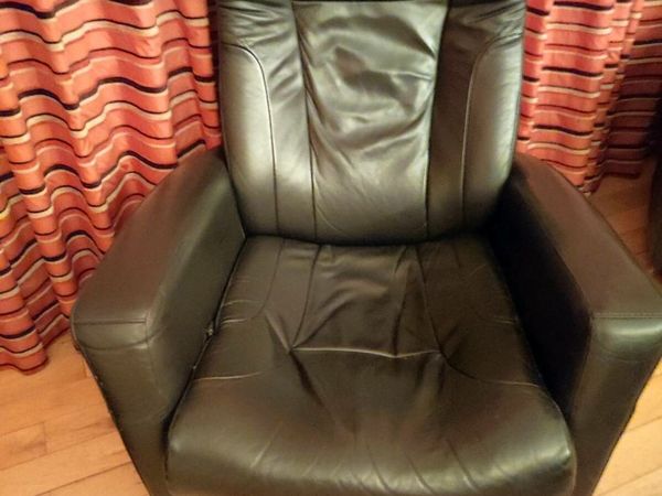 Two black leather recliner chairs