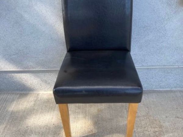 Four brown dining chairs
