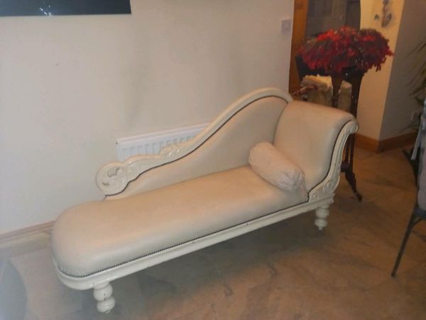 Antique chase long upholstered in cream faux lea