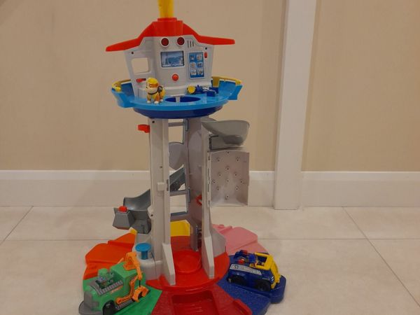 Paw patrol lookout tower with 2 vehicles & 3 pups.
