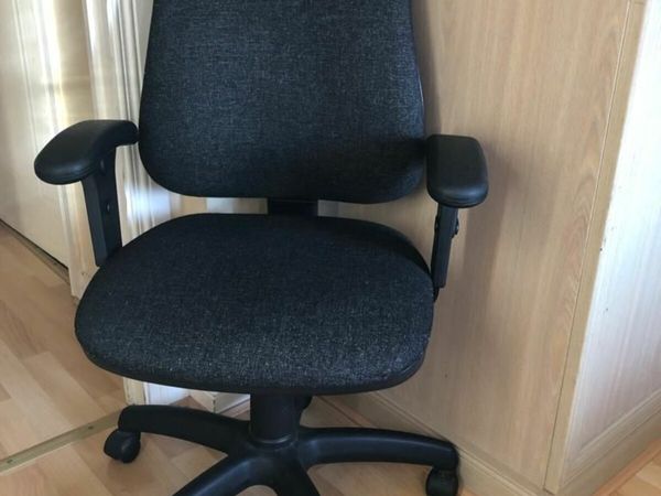 Office chair made of fabric material with adjustable armrests